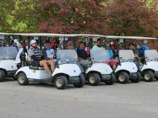 golfers waiting in golf carts for outing to begin